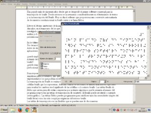 Imagen de una ventana en primer plano con los puntos braille. A un lado, debajo, está la ventana de Biblos. En ambas ventanas está el texto del artículo, en braille y en caracteres visuales. 